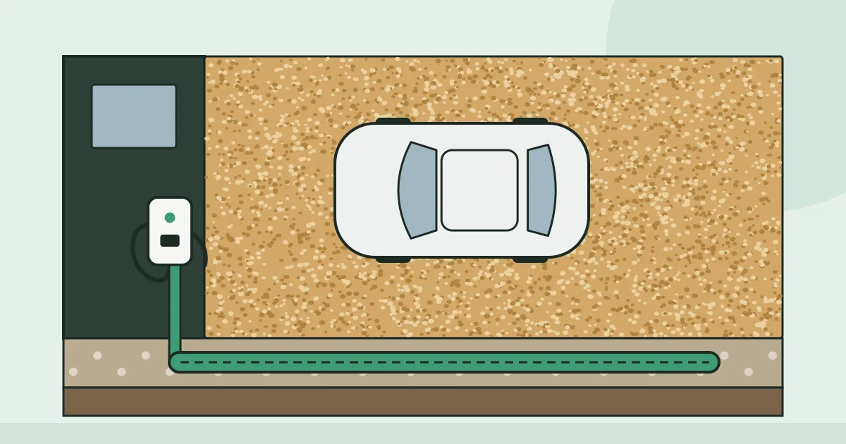 Illustration of a car parked on a new driveway beside a wall-mounted charger, with a cutaway showing a cable duct running beneath the surface